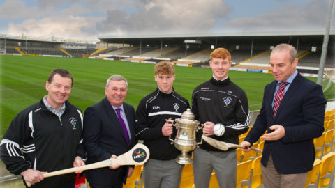 Former St. Kieran's College and Kilkenny star Charlie Carter of Top Oil demonstrating his famous solo run to from left, St. Kieran's Manager Tom Hogan, Top Oil Area Sales Manager Seamus Grace. Matin Keoghan, Vice Captain and Adrian Mullen, Captain, St. Kieran's College.